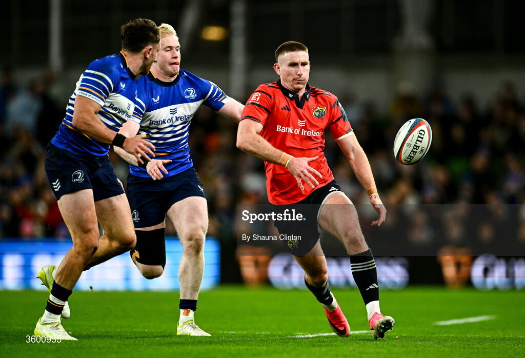 24 October 2026; Ben O'Connor of Munster despite the attention of Jamie Osborne and Hugo Keenan, left, of Leinster during the United Rugby Championship match between Leinster and Munster at the Aviva Stadium in Dublin. Photo by Shauna Clinton/Sportsfile