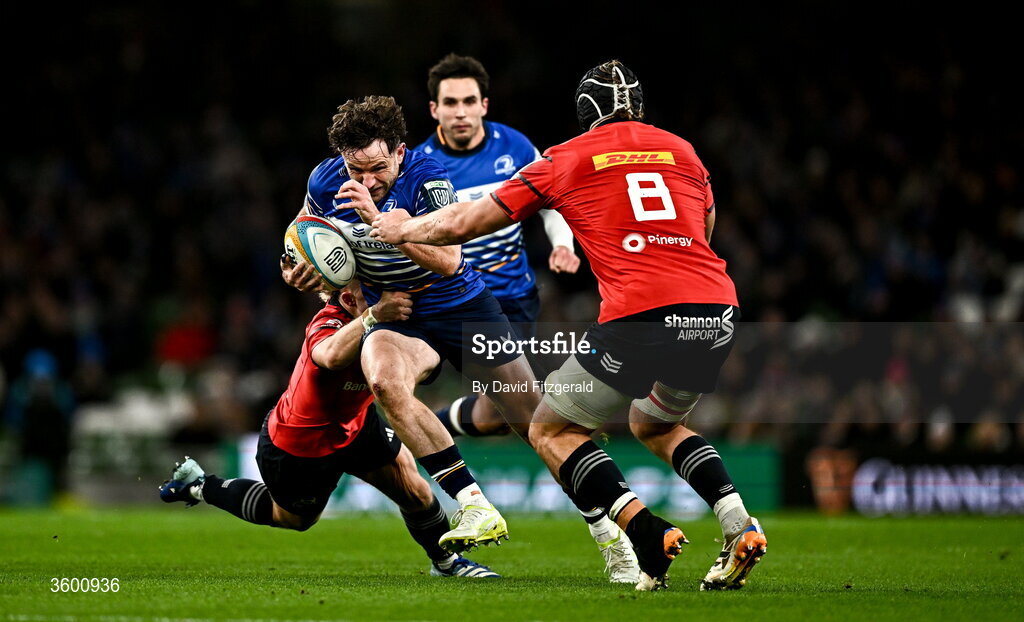 24 October 2026; Hugo Keenan of Leinster is tackled by Craig Casey, left, and Gavin Coombes of Munster during the United Rugby Championship match between Leinster and Munster at the Aviva Stadium in Dublin. Photo by David Fitzgerald/Sportsfile