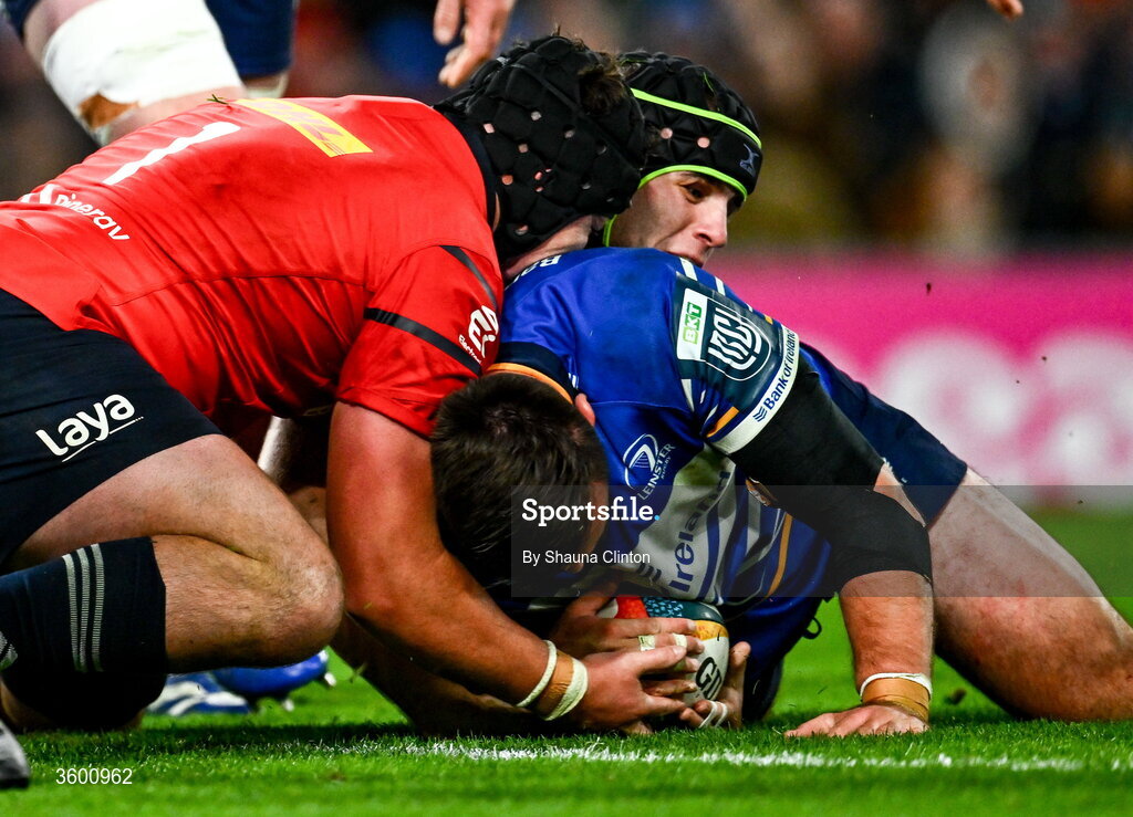 24 October 2026; Rónan Kelleher of Leinster is held up by Alex Kendellen and Josh Wycherley, 1, of Munster during the United Rugby Championship match between Leinster and Munster at the Aviva Stadium in Dublin. Photo by Shauna Clinton/Sportsfile