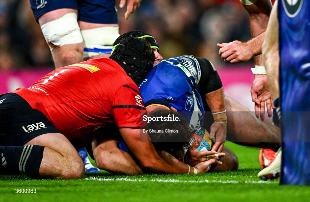 24 October 2026; Rónan Kelleher of Leinster is held up by Alex Kendellen and Josh Wycherley, 1, of Munster during the United Rugby Championship match between Leinster and Munster at the Aviva Stadium in Dublin. Photo by Shauna Clinton/Sportsfile