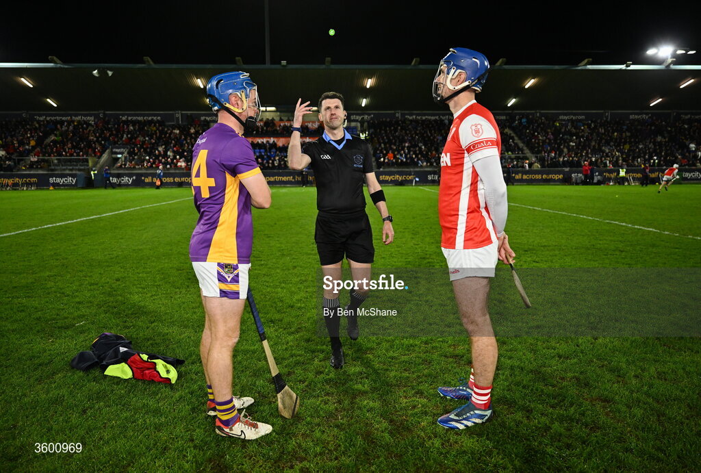 24 October 2026; Referee Sean Stack performs the coin-toss in the company of team captains Oisin O'Rorke of Kilmacud Crokes, left, and Sean Moran of Cuala before the PTSB Dublin County Senior Club Hurling Championship final match between Cuala and Kilmacud Crokes at Parnell Park in Dublin. Photo by Ben McShane/Sportsfile