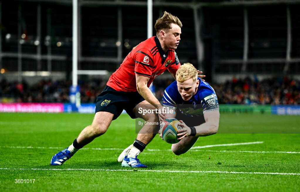 24 October 2026; Jamie Osborne of Leinster dives over to score his side's fourth try despite the tackle of Charlie O'Shea of Munster during the United Rugby Championship match between Leinster and Munster at the Aviva Stadium in Dublin. Photo by Shauna Clinton/Sportsfile