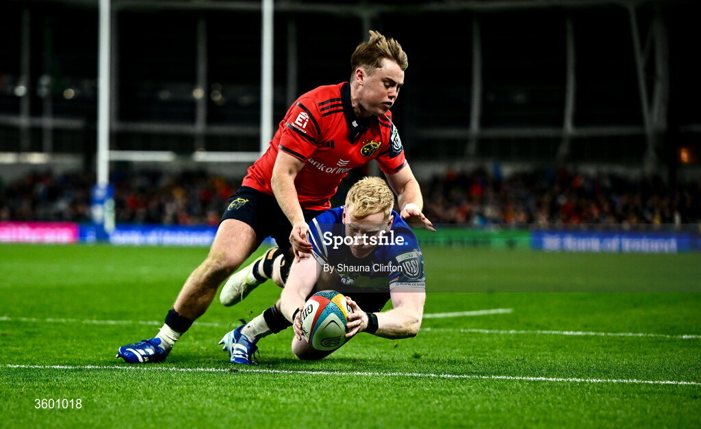 24 October 2026; Jamie Osborne of Leinster dives over to score his side's fourth try despite the tackle of Charlie O'Shea of Munster during the United Rugby Championship match between Leinster and Munster at the Aviva Stadium in Dublin. Photo by Shauna Clinton/Sportsfile
