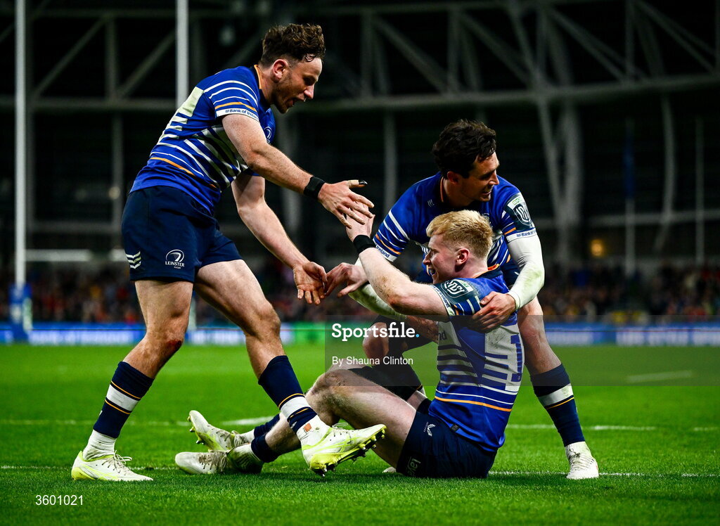 24 October 2026; Jamie Osborne of Leinster celebrates with team-mates Hugo Keenan, left, and Joey Carbery after scoring their side's fourth try during the United Rugby Championship match between Leinster and Munster at the Aviva Stadium in Dublin. Photo by Shauna Clinton/Sportsfile