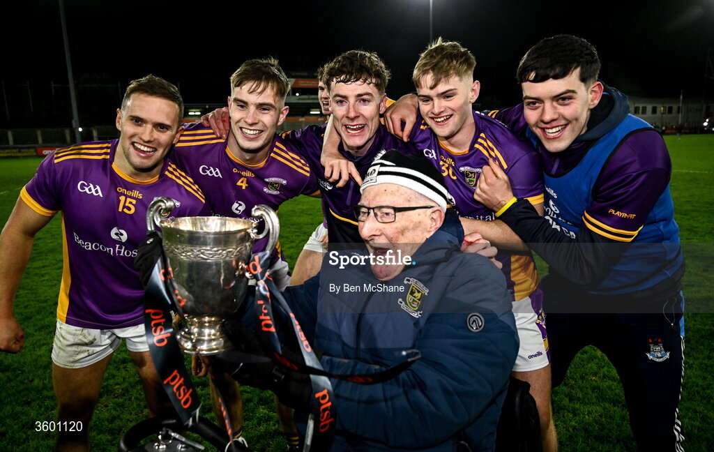 24 October 2026; Kilmacud Crokes players celebrate with Kilmacud Crokes supporter and member Mick Hynes and the cup after the PTSB Dublin County Senior Club Hurling Championship final match between Cuala and Kilmacud Crokes at Parnell Park in Dublin. Photo by Ben McShane/Sportsfile