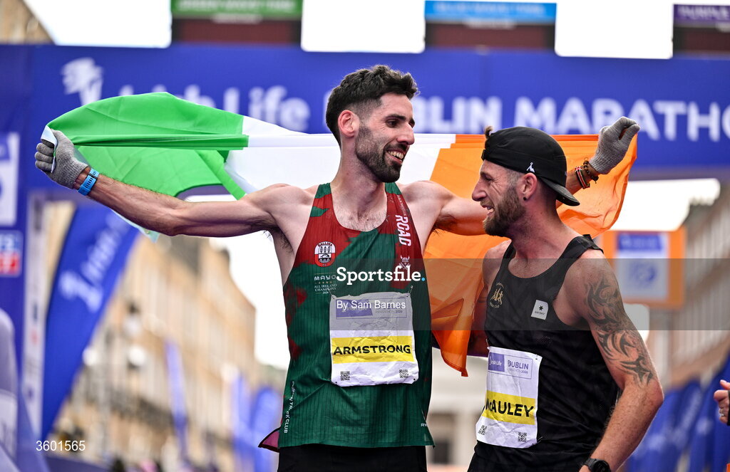 25 October 2026; National champion Hugh Armstrong of Ireland, left, with Stephen McAuley of Ireland during the 2026 Irish Life Dublin Marathon, as thousands of runners took to the streets of Dublin for the 45th running of the event. Photo by Sam Barnes/Sportsfile