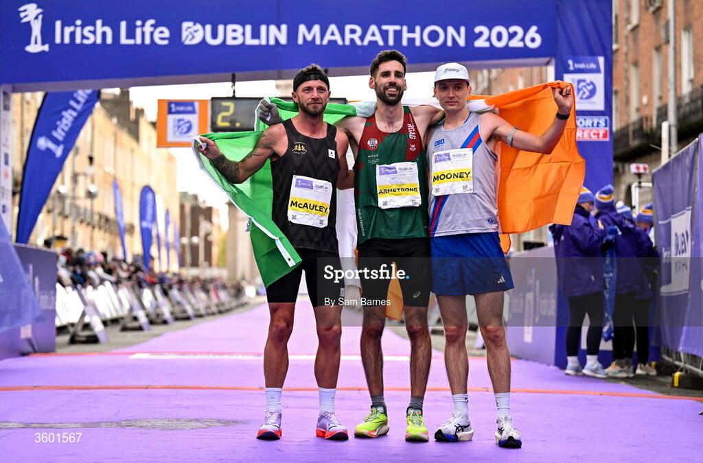 25 October 2026; National Champioship and top 3 Irish finishers, from left, third place Stephen McAuley, winner Hugh Armstrong and third place Killian Mooney during the 2026 Irish Life Dublin Marathon, as thousands of runners took to the streets of Dublin for the 45th running of the event. Photo by Sam Barnes/Sportsfile
