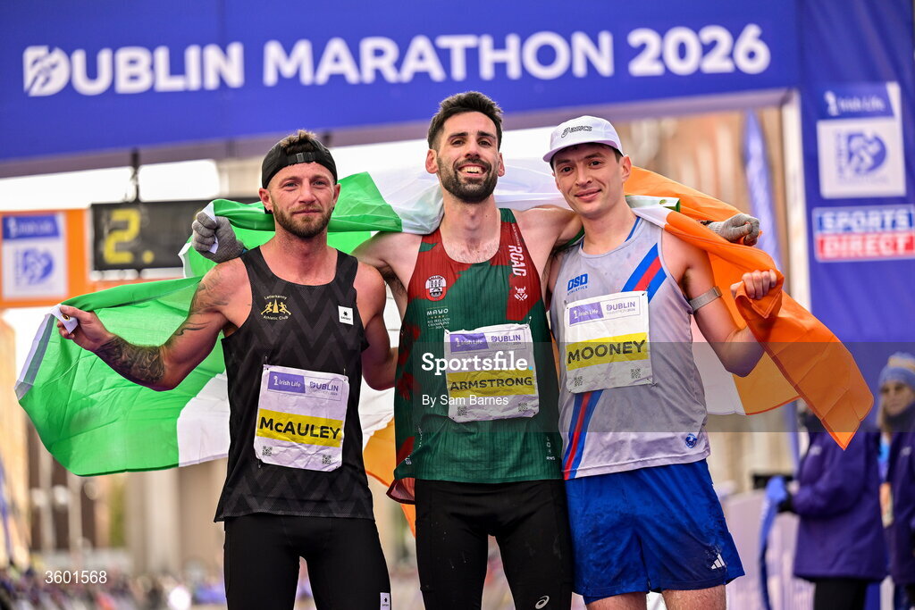 25 October 2026; National Champioship and top 3 Irish finishers, from left, third place Stephen McAuley, winner Hugh Armstrong and third place Killian Mooney during the 2026 Irish Life Dublin Marathon, as thousands of runners took to the streets of Dublin for the 45th running of the event. Photo by Sam Barnes/Sportsfile