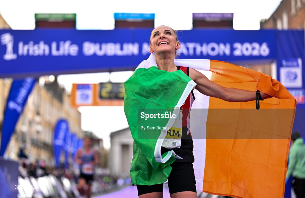 25 October 2026; Women's National champion Judith Storm of Ireland celebrates after the 2026 Irish Life Dublin Marathon, as thousands of runners took to the streets of Dublin for the 45th running of the event. Photo by Sam Barnes/Sportsfile