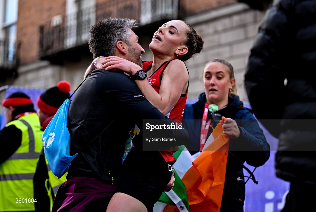 25 October 2026; Judith Storm of Ireland celebrates with friends and family during the 2026 Irish Life Dublin Marathon, as thousands of runners took to the streets of Dublin for the 45th running of the event. Photo by Sam Barnes/Sportsfile