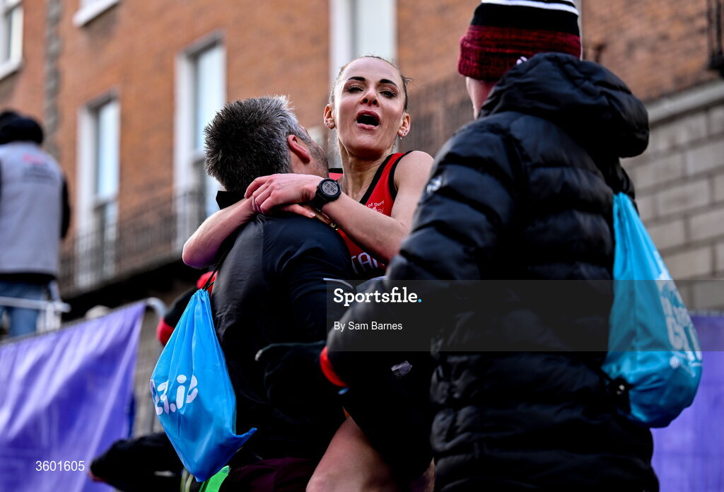 25 October 2026; Judith Storm of Ireland celebrates with friends and family during the 2026 Irish Life Dublin Marathon, as thousands of runners took to the streets of Dublin for the 45th running of the event. Photo by Sam Barnes/Sportsfile