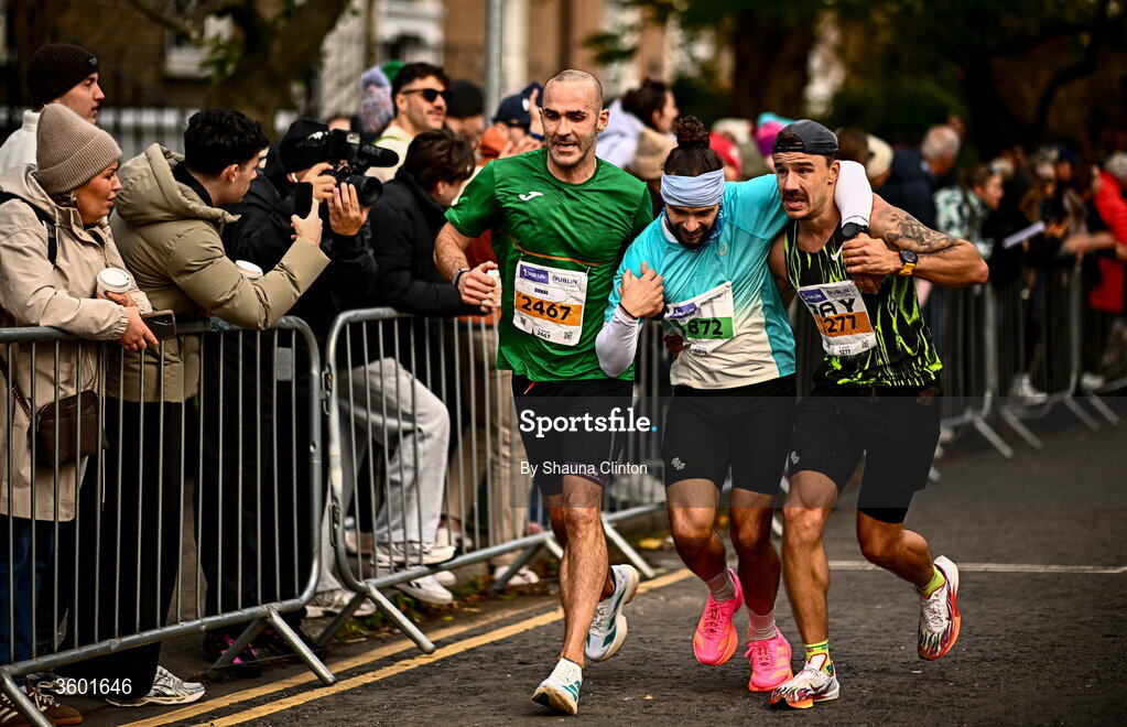 25 October 2026; Participants, from left, Donal Rodgers, Luiz Piazza and Joao Colososchi during the 2026 Irish Life Dublin Marathon, as thousands of runners took to the streets of Dublin for the 45th running of the event. Photo by Shauna Clinton/Sportsfile