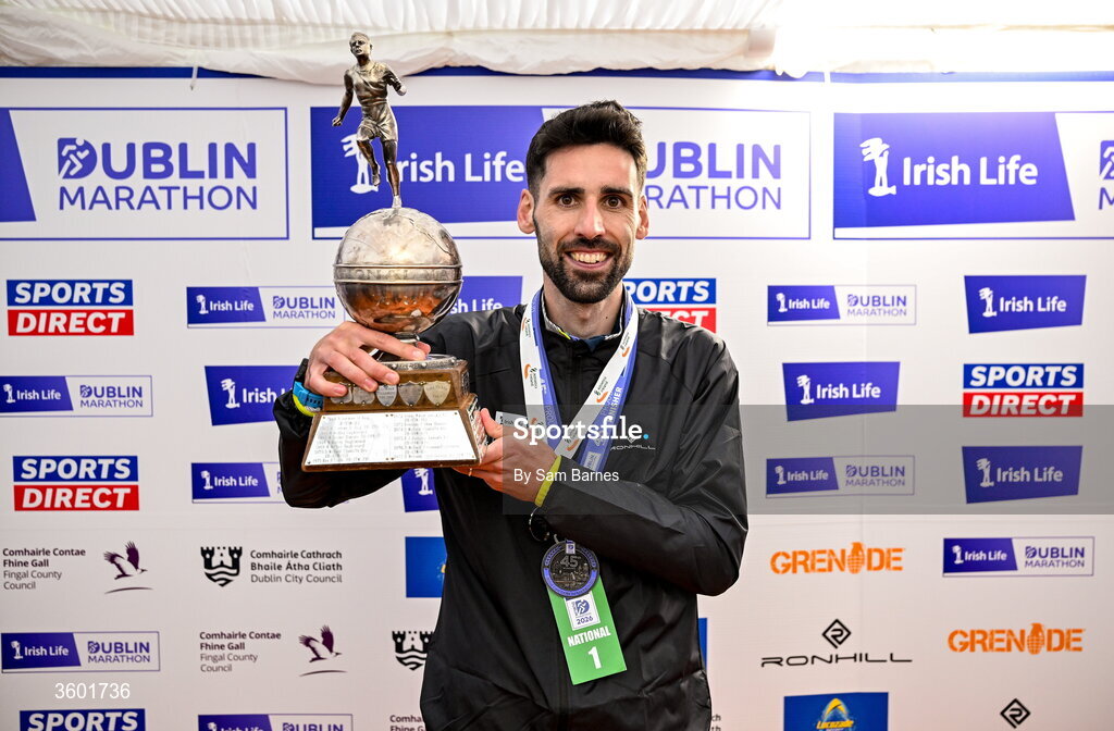 25 October 2026; Men's National Champion Hugh Armstrong with the trophy after the 2026 Irish Life Dublin Marathon, as thousands of runners took to the streets of Dublin for the 45th running of the event. Photo by Sam Barnes/Sportsfile