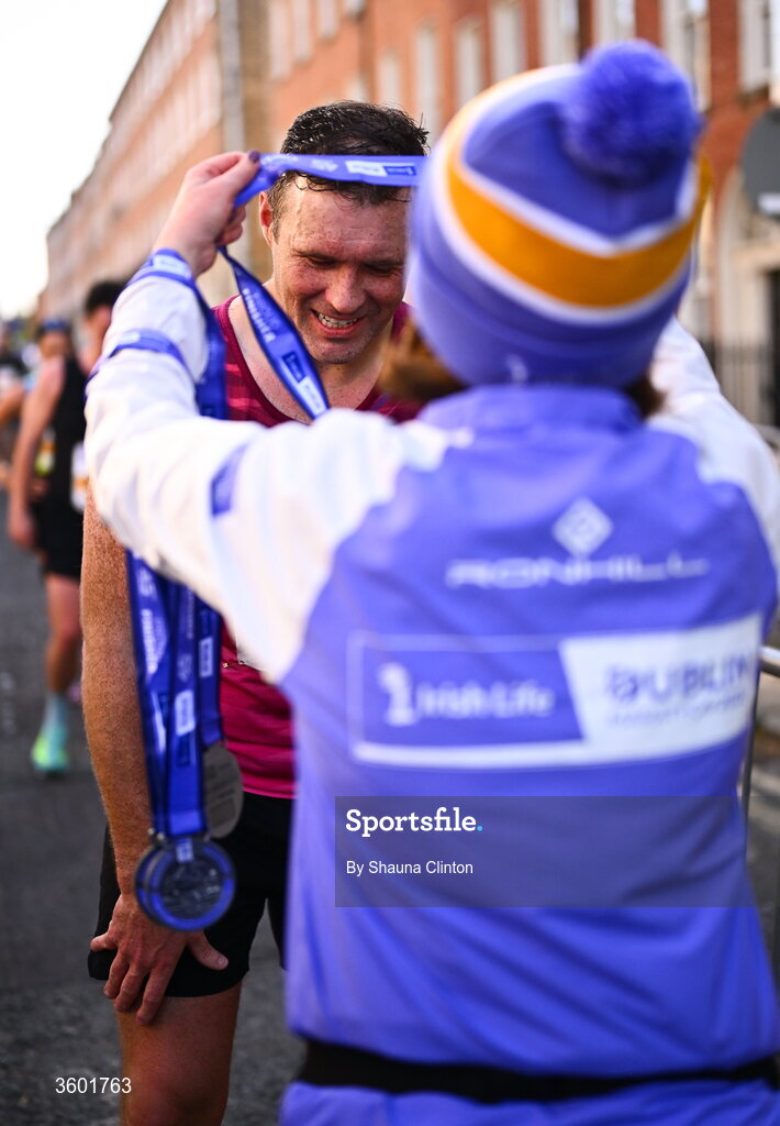 25 October 2026; Participants receive their finishers medals during the 2026 Irish Life Dublin Marathon, as thousands of runners took to the streets of Dublin for the 45th running of the event. Photo by Shauna Clinton/Sportsfile