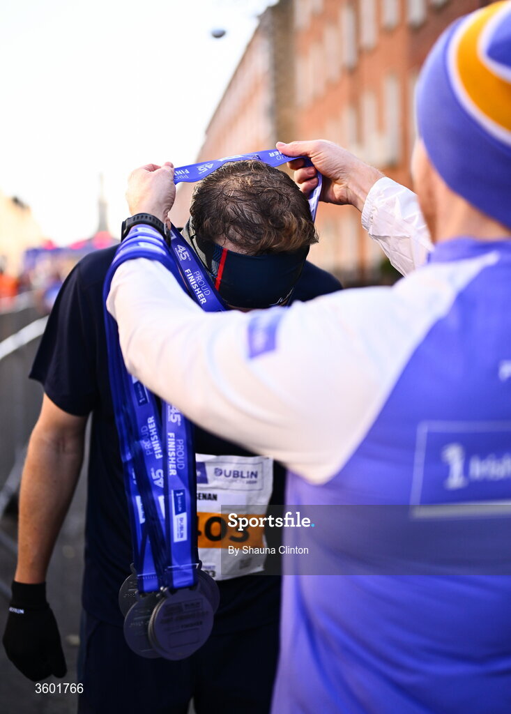 25 October 2026; Participants receive their finishers medals during the 2026 Irish Life Dublin Marathon, as thousands of runners took to the streets of Dublin for the 45th running of the event. Photo by Shauna Clinton/Sportsfile