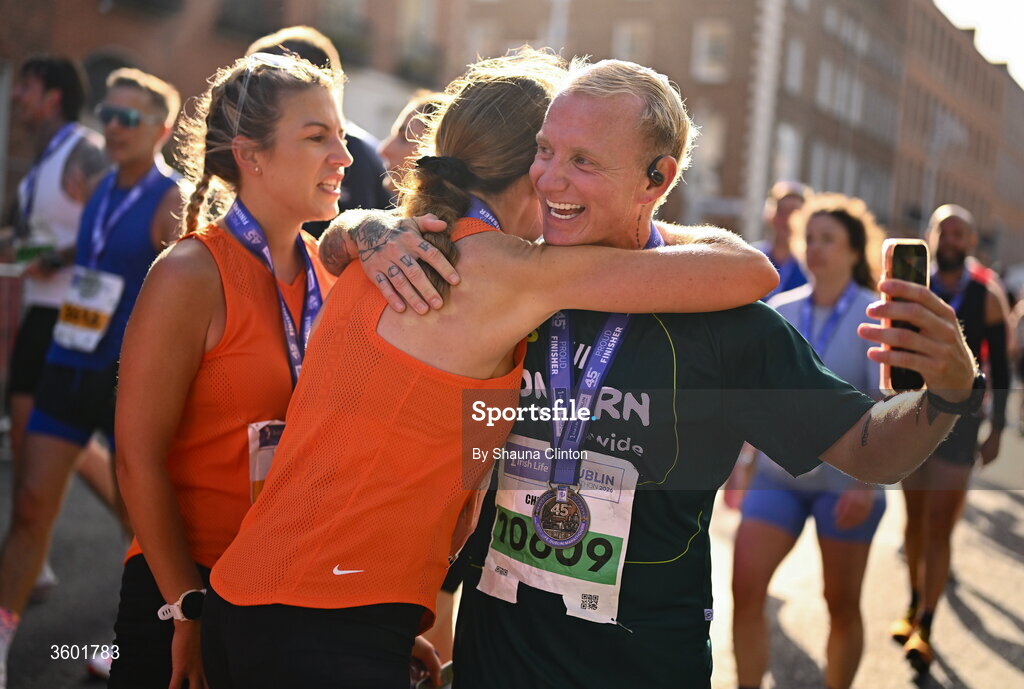 25 October 2026; Christopher Connolly with participants after the 2026 Irish Life Dublin Marathon, as thousands of runners took to the streets of Dublin for the 45th running of the event. Photo by Shauna Clinton/Sportsfile