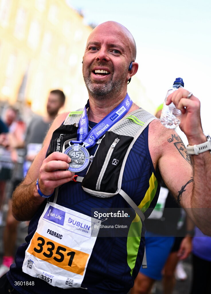 25 October 2026; Participants receive their finishers medals after the 2026 Irish Life Dublin Marathon, as thousands of runners took to the streets of Dublin for the 45th running of the event. Photo by Shauna Clinton/Sportsfile