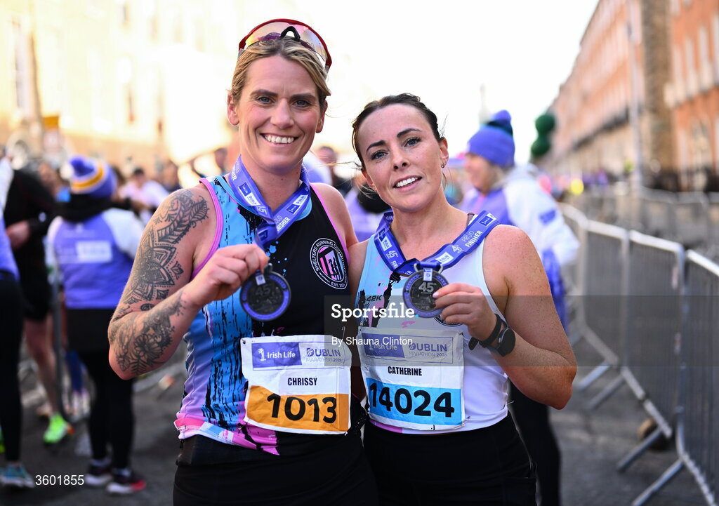 25 October 2026; Chrissy Harford of Shelters Running Community AC, Dublin, left, and Catherine Dunne of Shelters Running Community AC, Dublin, after the 2026 Irish Life Dublin Marathon, as thousands of runners took to the streets of Dublin for the 45th running of the event. Photo by Shauna Clinton/Sportsfile