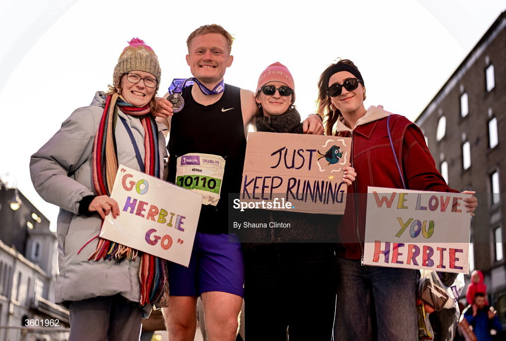 25 October 2026; Herbie Fowler Hudson with family after the 2026 Irish Life Dublin Marathon, as thousands of runners took to the streets of Dublin for the 45th running of the event. Photo by Shauna Clinton/Sportsfile