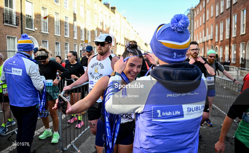 25 October 2026; Participants receive their finishers medals after the 2026 Irish Life Dublin Marathon, as thousands of runners took to the streets of Dublin for the 45th running of the event. Photo by Sam Barnes/Sportsfile