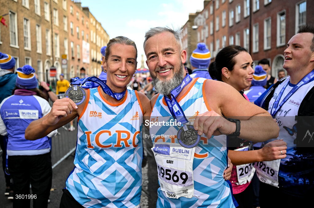 25 October 2026; Alison Mc Carthy, left, and Gary Mc Cowen after the 2026 Irish Life Dublin Marathon, as thousands of runners took to the streets of Dublin for the 45th running of the event. Photo by Sam Barnes/Sportsfile