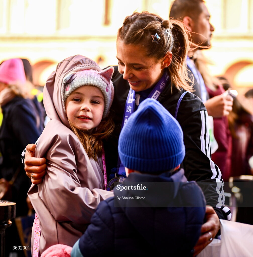 25 October 2026; Participants with family after the 2026 Irish Life Dublin Marathon, as thousands of runners took to the streets of Dublin for the 45th running of the event. Photo by Shauna Clinton/Sportsfile