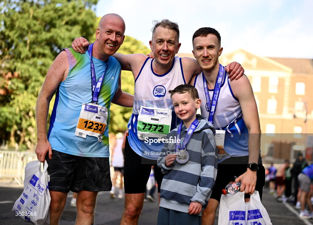25 October 2026; Gerard Bonass, centre, and friends after the 2026 Irish Life Dublin Marathon. Photo by Shauna Clinton/Sportsfile