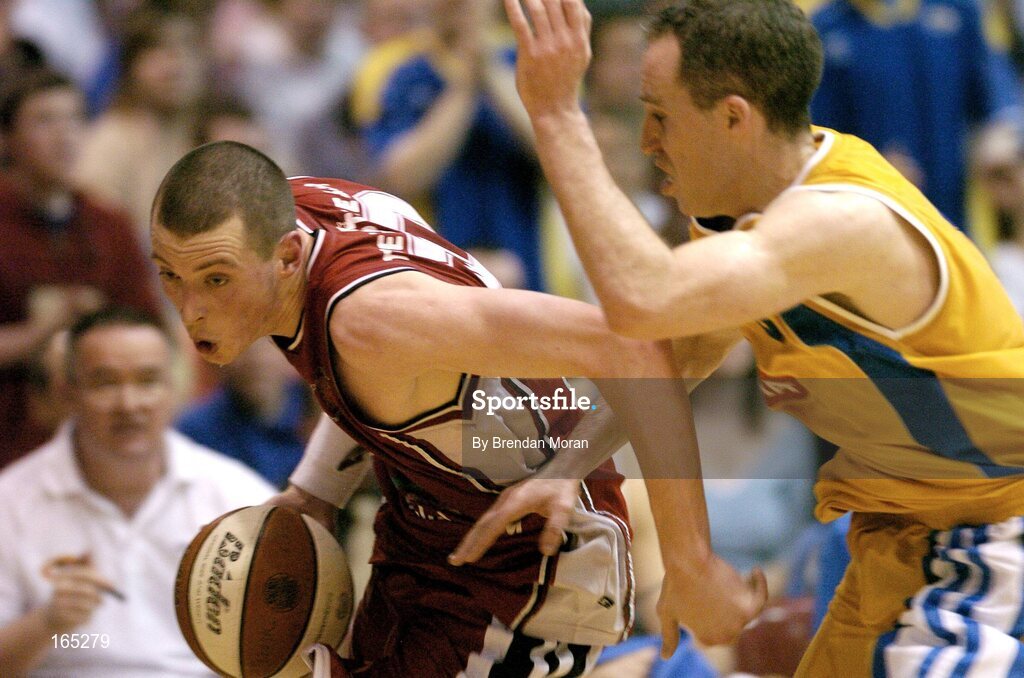30 January 2005; Kieran Donaghy, Abrakebabra Tigers, Tralee, in action against Dave Donnelly, Roma St Vincent's. National Cup, Senior Men's Final, Abrakebabra Tigers, Tralee v Roma St Vincent's, ESB Arena, Tallaght, Dublin. Picture credit; Brendan Moran / SPORTSFILE