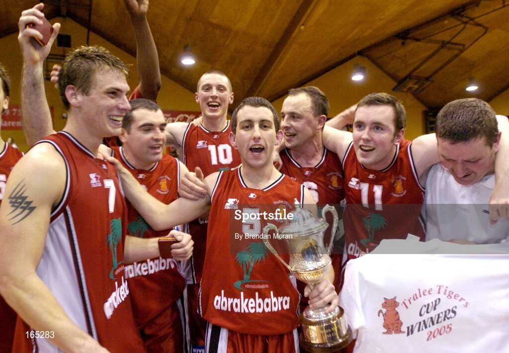 30 January 2005; Abrakebabra Tigers players, from left, Chris Craig, Liam Brosnan, Kieran Donaghy, Kevin O'Donoghue, John Teahan, Liam Culloty and Assistant coach Joe Quirke celebrate with the cup after the game. National Cup, Senior Men's Final, Abrakebabra Tigers, Tralee v Roma St Vincent's, ESB Arena, Tallaght, Dublin. Picture credit; Brendan Moran / SPORTSFILE