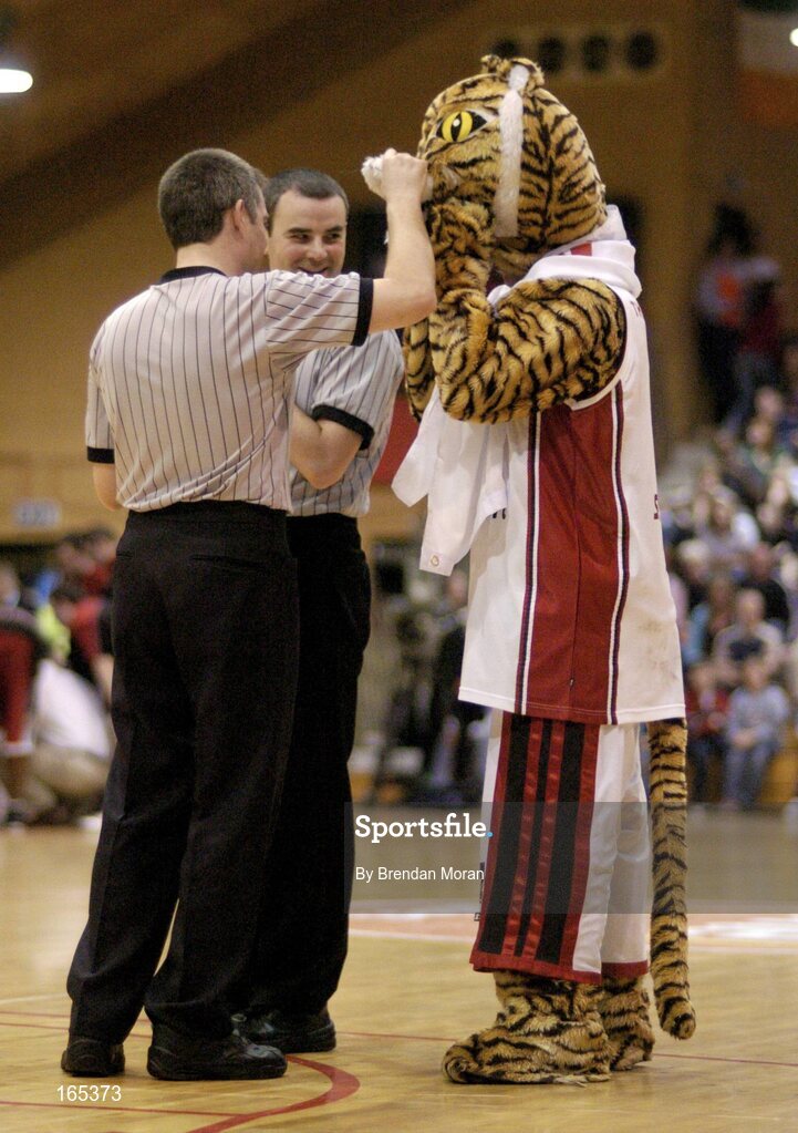 30 January 2005; The Abrakebabra Tigers mascot has a word with referee's Dave Collings and Paul Dempsey. National Cup, Senior Men's Final, Abrakebabra Tigers, Tralee v Roma St Vincent's, ESB Arena, Tallaght, Dublin. Picture credit; Brendan Moran / SPORTSFILE