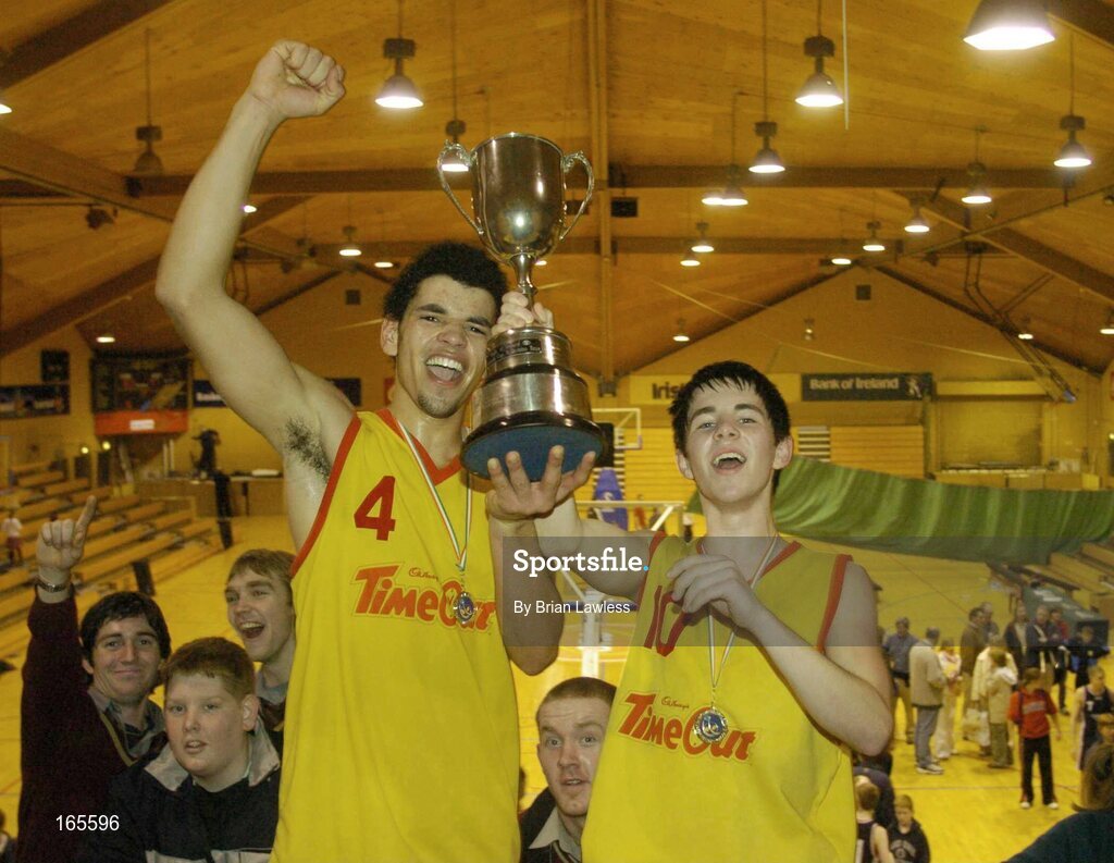 3 February 2005; Co-captains Aaron Westbrooks, left, and Erin Grace, St. Fintan's, Sutton, lift the cup after victory in the final. All-Ireland Schools Cup, U19 A Boys Final, St. Fintan's, Sutton, Dublin v Calasanctius, Oranmore, Galway, National Basketball Arena, Tallaght, Dublin. Picture credit; Brian Lawless / SPORTSFILE