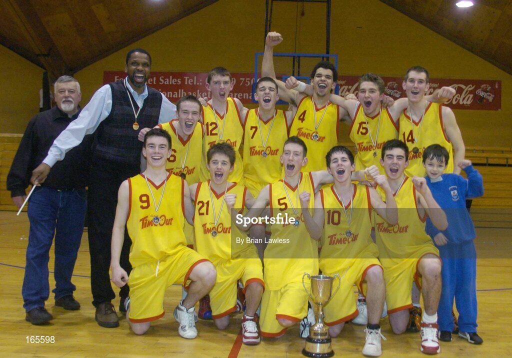3 February 2005; The St. Fintan's, Sutton, team with coach Jerome Westbrooks and assistant coach Todd James, left, celebrate with the cup after victory in the final. All-Ireland Schools Cup, U19 A Boys Final, St. Fintan's, Sutton, Dublin v Calasanctius, Oranmore, Galway, National Basketball Arena, Tallaght, Dublin. Picture credit; Brian Lawless / SPORTSFILE