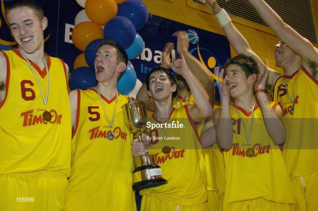 3 February 2005; St. Fintan's players, from left, Darren O'Moore, Jody O'Neill, Erin Grace, Nicholas Pavlin and Conor Baron, celebrate with the cup after victory in the final. All-Ireland Schools Cup, U19 A Boys Final, St. Fintan's, Sutton, Dublin v Calasanctius, Oranmore, Galway, National Basketball Arena, Tallaght, Dublin. Picture credit; Brian Lawless / SPORTSFILE