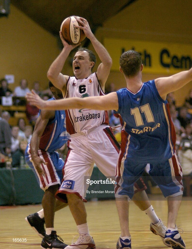 29 January 2005; John Teahan, Abrakebabra Tigers, Tralee, in action against Tim O'Halloran (11), Mardyke UCC Demons. National Cup, Senior Men's Semi-Final, Mardyke UCC Demons v Abrakebabra Tigers, Tralee, ESB Arena, Tallaght, Dublin. Picture credit; Brendan Moran / SPORTSFILE