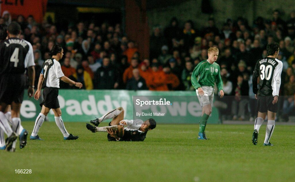 9 February 2005; Cristiano Ronaldo, Portugal, lies injured after he was challenged for possession by Damien Duff,  Republic of Ireland. International Friendly, Republic of Ireland v Portugal, Lansdowne Road, Dublin. Picture credit; David Maher / SPORTSFILE