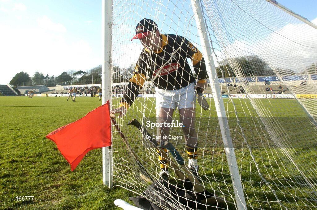 12 February 2005; James McGarry, Kilkenny goalkeeper reaches for a hurl beside the red flag which indicates two points for a sideline cut which goes straight over the bar. Walsh Cup Final, Wexford v Kilkenny, Wexford Park, Co. Wexford. Picture credit; Damien Eagers / SPORTSFILE