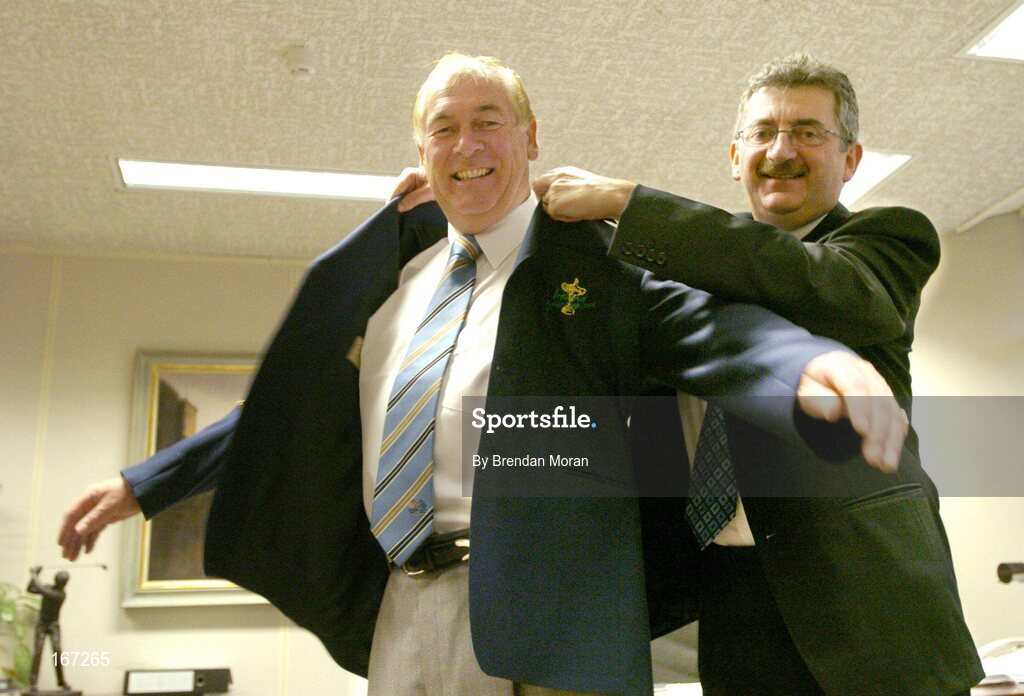 21 February 2005; AIB, one of the partners in Ireland's successful bid to bring the Ryder Cup to Ireland in 2006, has strengthened its Ryder Cup links by signing Christy O'Connor Jnr to be their Ryder Cup ambassador up to and including the event in September 2006. Helping Christy with his jacket is Billy Andrews of AIB. AIB Bankcentre, Ballsbridge, Dublin. Picture credit; Brendan Moran / SPORTSFILE