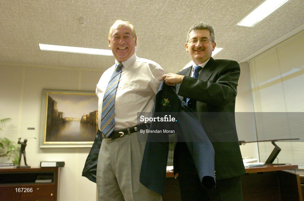21 February 2005; AIB, one of the partners in Ireland's successful bid to bring the Ryder Cup to Ireland in 2006, has strengthened its Ryder Cup links by signing Christy O'Connor Jnr to be their Ryder Cup ambassador up to and including the event in September 2006. Helping Christy with his jacket is Billy Andrews of AIB. AIB Bankcentre, Ballsbridge, Dublin. Picture credit; Brendan Moran / SPORTSFILE