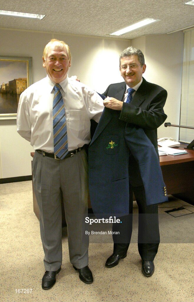 21 February 2005; AIB, one of the partners in Ireland's successful bid to bring the Ryder Cup to Ireland in 2006, has strengthened its Ryder Cup links by signing Christy O'Connor Jnr to be their Ryder Cup ambassador up to and including the event in September 2006. Helping Christy with his jacket is Billy Andrews of AIB. AIB Bankcentre, Ballsbridge, Dublin. Picture credit; Brendan Moran / SPORTSFILE