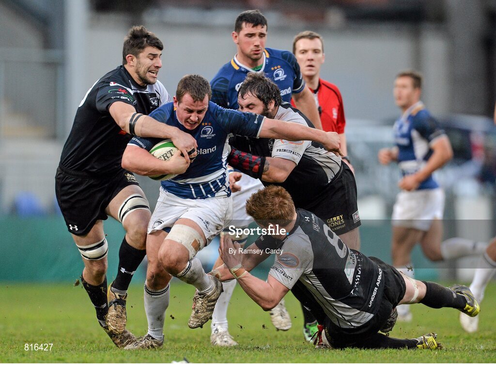 7 December 2013; Tadhg Furlong, Leinster 'A', is tackled by Tom Lampard, left, and Adam Powell, Cross Keys. British & Irish Cup, Leinster 'A' v Cross Keys, Donnybrook Stadium, Donnybrook, Dublin. Picture credit: Ramsey Cardy / SPORTSFILE