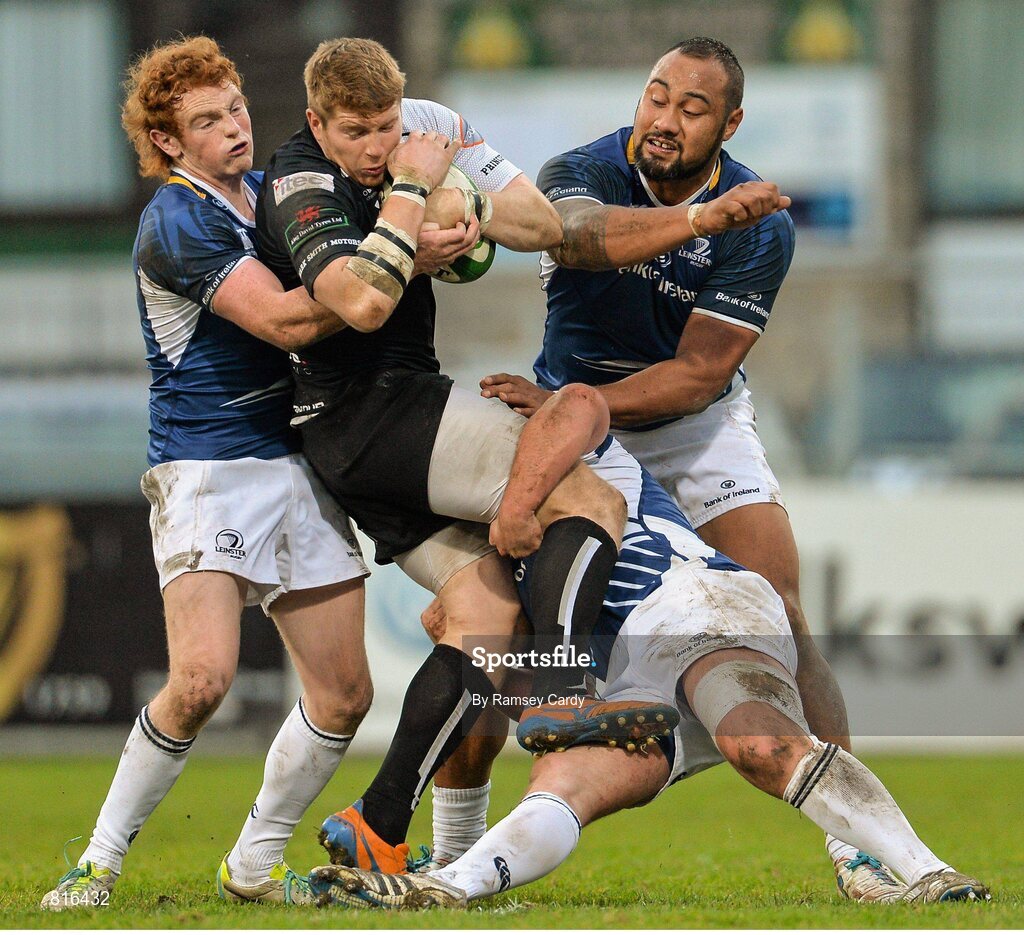 7 December 2013; James Cordy-Redden, Cross Keys, is tackled by Cathal Marsh, left, Darren Hudson, and Leo Auva'a, right.  Leinster 'A. British & Irish Cup, Leinster 'A' v Cross Keys, Donnybrook Stadium, Donnybrook, Dublin. Picture credit: Ramsey Cardy / SPORTSFILE