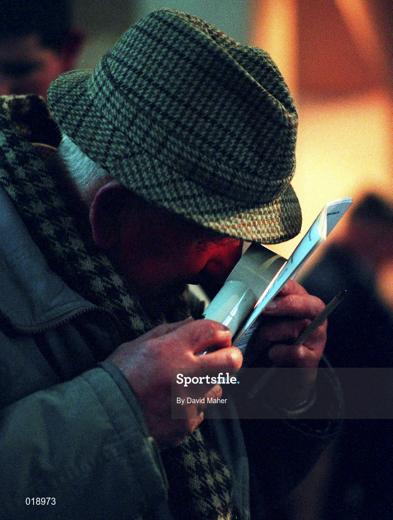 18 January 1997; A punter examines his racecard during a greyhound racing meeting at Shelbourne Park in Dublin. Photo by David Maher/Sportsfile