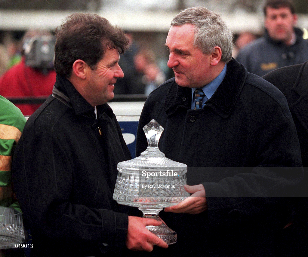 24 January 1999, An Taoiseach Bertie Ahern TD presents owner JP McManus with the trophy after he sent out Istabraq to win the AIG Europe Champion Hurdle at Leopardstown Racecourse in Dublin. Photo by Ray McManus/Sportsfile