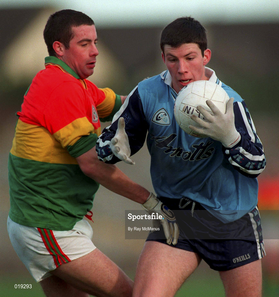 16 January 1999; Niall O'Donoghue of Dublin is tackled by Joe Byrne of Carlow during the O'Byrne Cup Quarter-Final match between Carlow and Dublin at Dr Cullen Park in Carlow. Photo by Ray McManus/Sportsfile