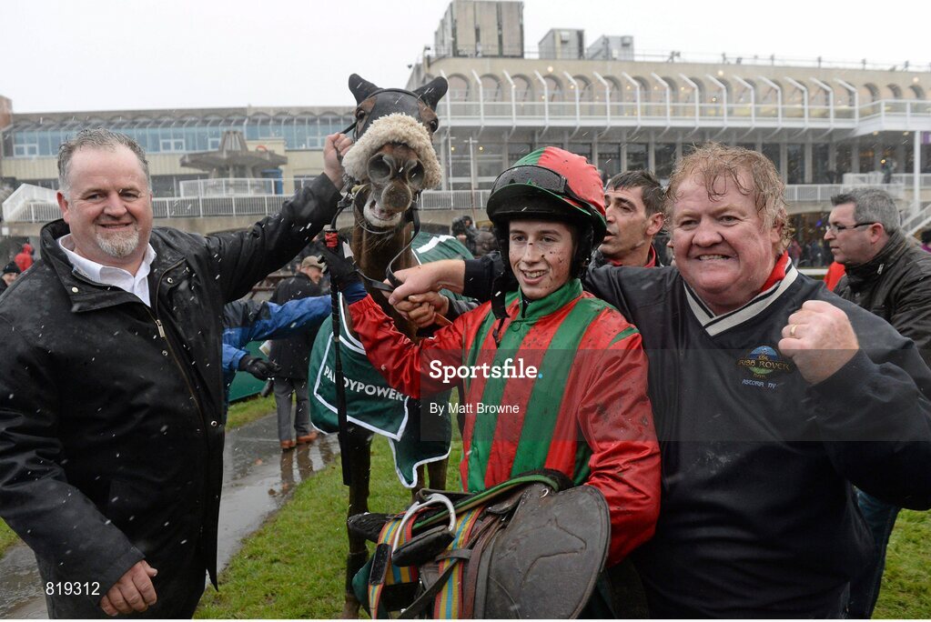27 December 2013; Niall Reilly, left, and Aidan Shields, right, celebrate with jockey Bryan Cooper after their horse Benefficient won the Paddy Power Dial-a-Bet Steeplechase. Leopardstown Christmas Racing Festival 2013, Leopardstown Racetrack, Leopardstown, Co. Dublin. Picture credit: Matt Browne / SPORTSFILE