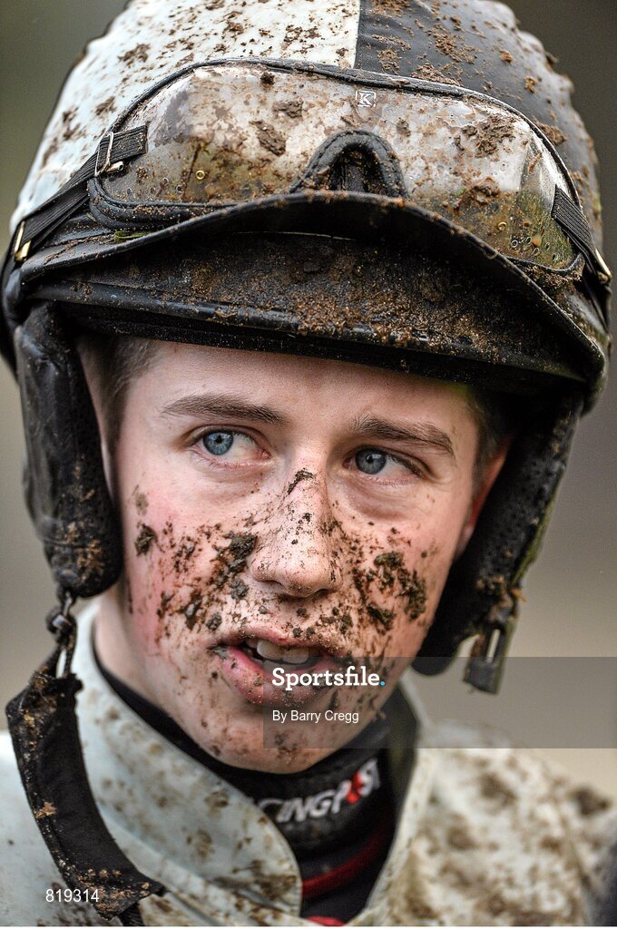 27 December 2013; Jockey Bryan Cooper shows the signs of the ground conditions after he rode Art of Payroll in the Paddy Power Future Champions Novice Hurdle. Leopardstown Christmas Racing Festival 2013, Leopardstown Racetrack, Leopardstown, Co. Dublin. Picture credit: Barry Cregg / SPORTSFILE
