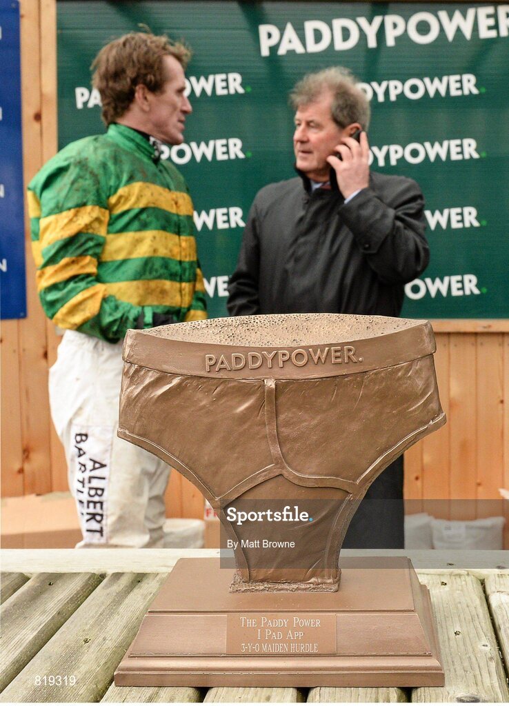 27 December 2013; Owner JP McManus and jockey Tony McCoy wait to pick up their trophies after winning the Paddy Power iPad App 3-Y-O Maiden Hurdle. Leopardstown Christmas Racing Festival 2013, Leopardstown Racetrack, Leopardstown, Co. Dublin. Picture credit: Matt Browne / SPORTSFILE