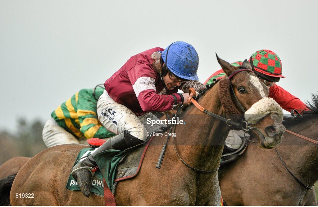 27 December 2013; Rocky Wednesday, with Robbie Colgan up, races Lastoftheleaders, with Bryan Cooper up, towards the finish on their way to winning the Paddy Power Handicap Hurdle. Leopardstown Christmas Racing Festival 2013, Leopardstown Racetrack, Leopardstown, Co. Dublin. Picture credit: Barry Cregg / SPORTSFILE