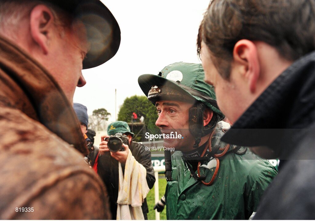 27 December 2013; Jockey Ruby Walsh speaking to trainer Willie Mullins after riding Rockyaboya to win the Paddy Power Steeplechase. Leopardstown Christmas Racing Festival 2013, Leopardstown Racetrack, Leopardstown, Co. Dublin. Picture credit: Barry Cregg / SPORTSFILE