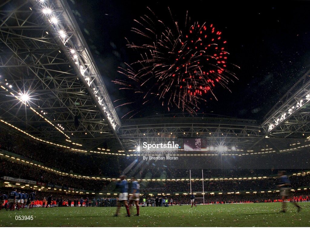 6 November 1999; The French players leave the pitch after being defeated by Australia as fireworks light up the evening sky to signal the end of the 1999 Rugby World Cup. 1999 Rugby World Cup Final, Australia v France, Millennium Stadium, Cardiff, Wales. Picture credit: Brendan Moran / SPORTSFILE